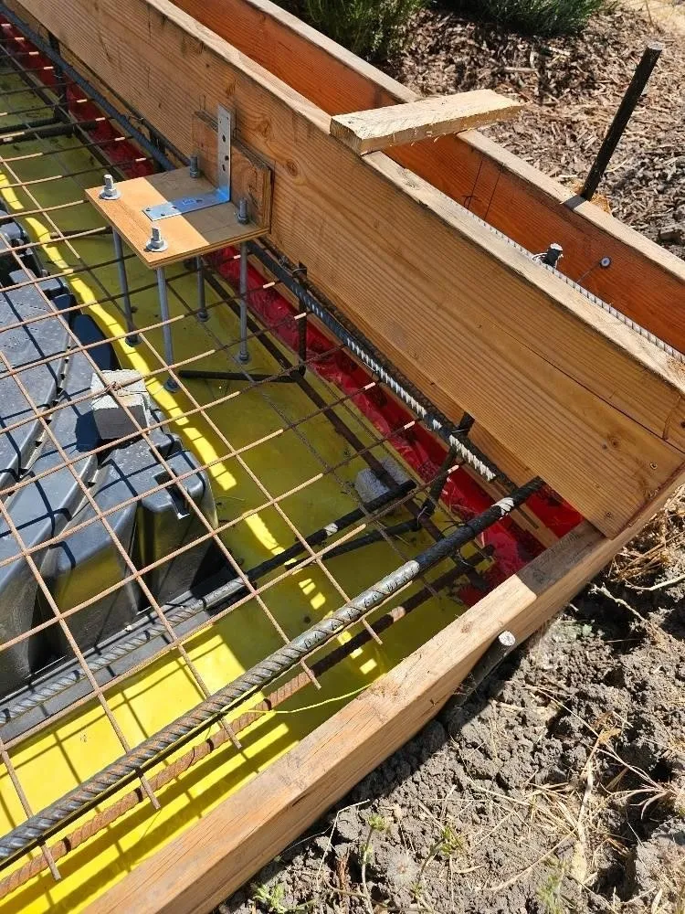 Rebar mat tied across void forms before the pour